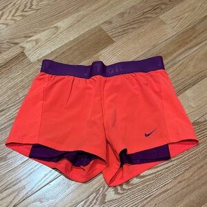 Nike Women's Vibrant Orange Shorts with Purple Waistband